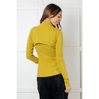 Our Pear-fectly Yellow Activewear Jacket is form-fitting and features a brushed microfiber material with mock neckline