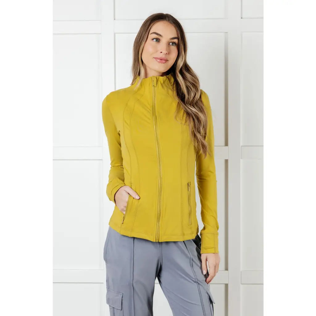 Our Pear-fectly Yellow Activewear Jacket is form-fitting and features a brushed microfiber material with mock neckline
