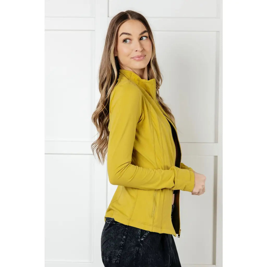 Our Pear-fectly Yellow Activewear Jacket is form-fitting and features a brushed microfiber material with mock neckline