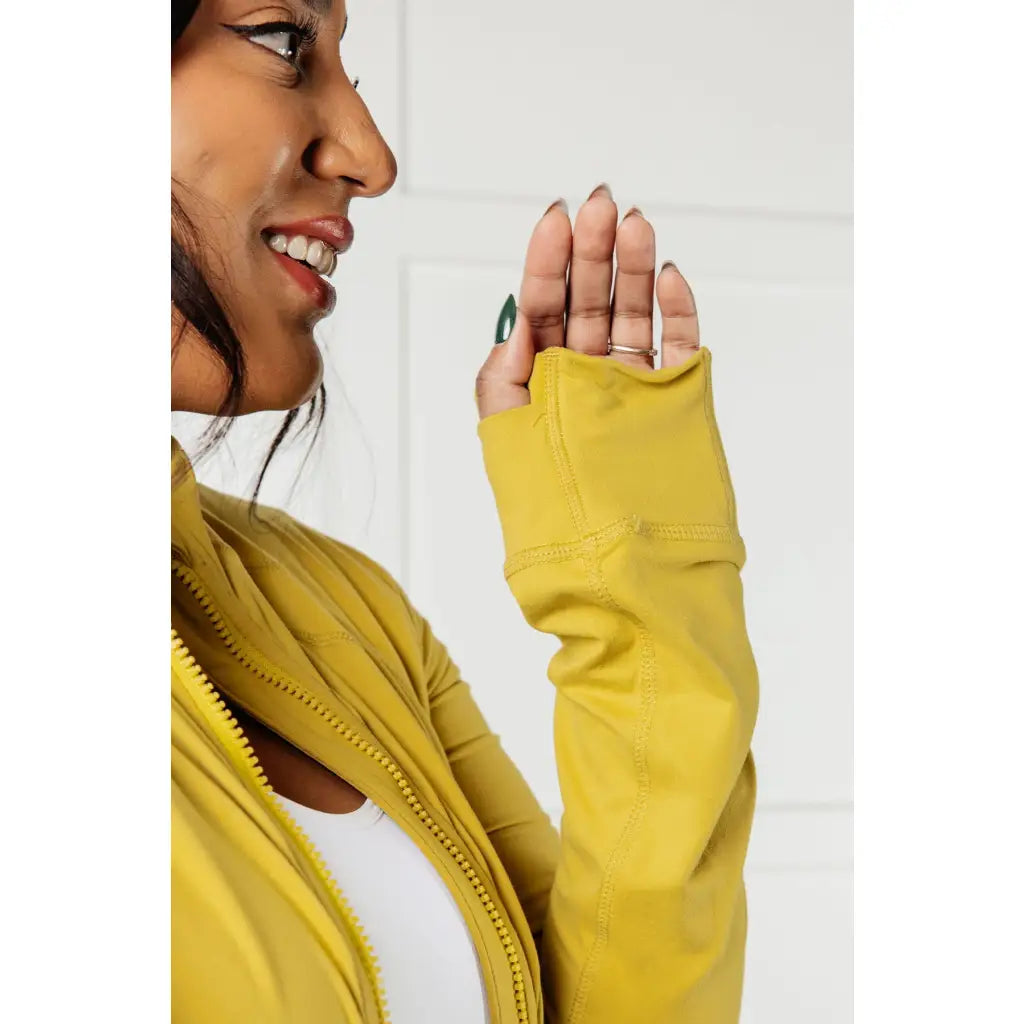 Our Pear-fectly Yellow Activewear Jacket is form-fitting and features a brushed microfiber material with mock neckline