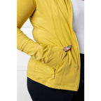 Our Pear-fectly Yellow Activewear Jacket is form-fitting and features a brushed microfiber material with mock neckline