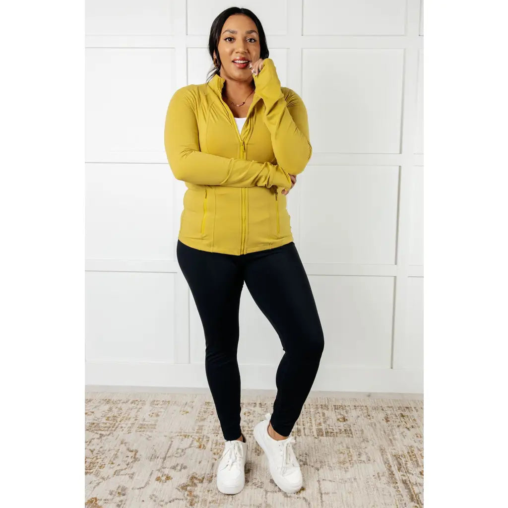 Our Pear-fectly Yellow Activewear Jacket is form-fitting and features a brushed microfiber material with mock neckline