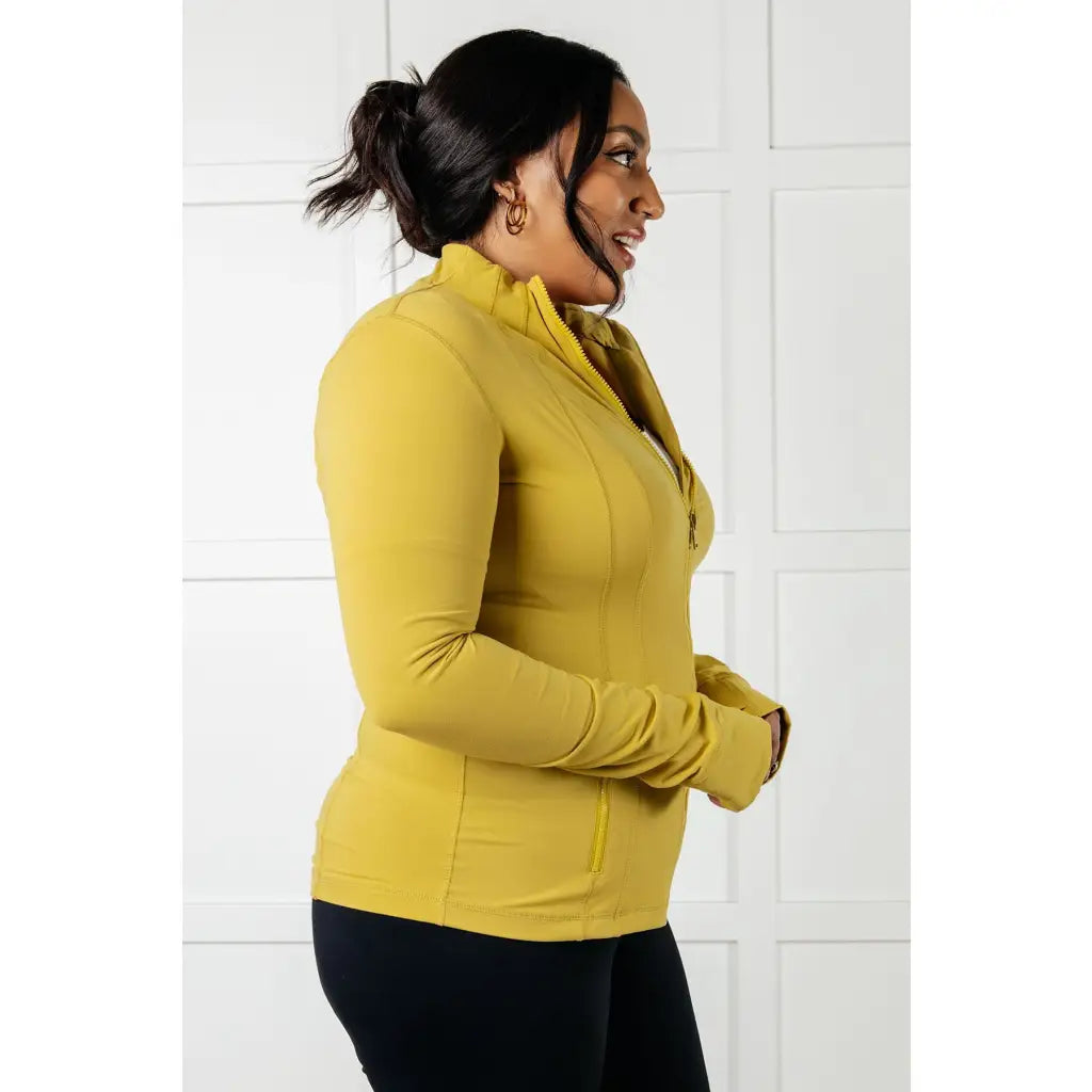 Our Pear-fectly Yellow Activewear Jacket is form-fitting and features a brushed microfiber material with mock neckline