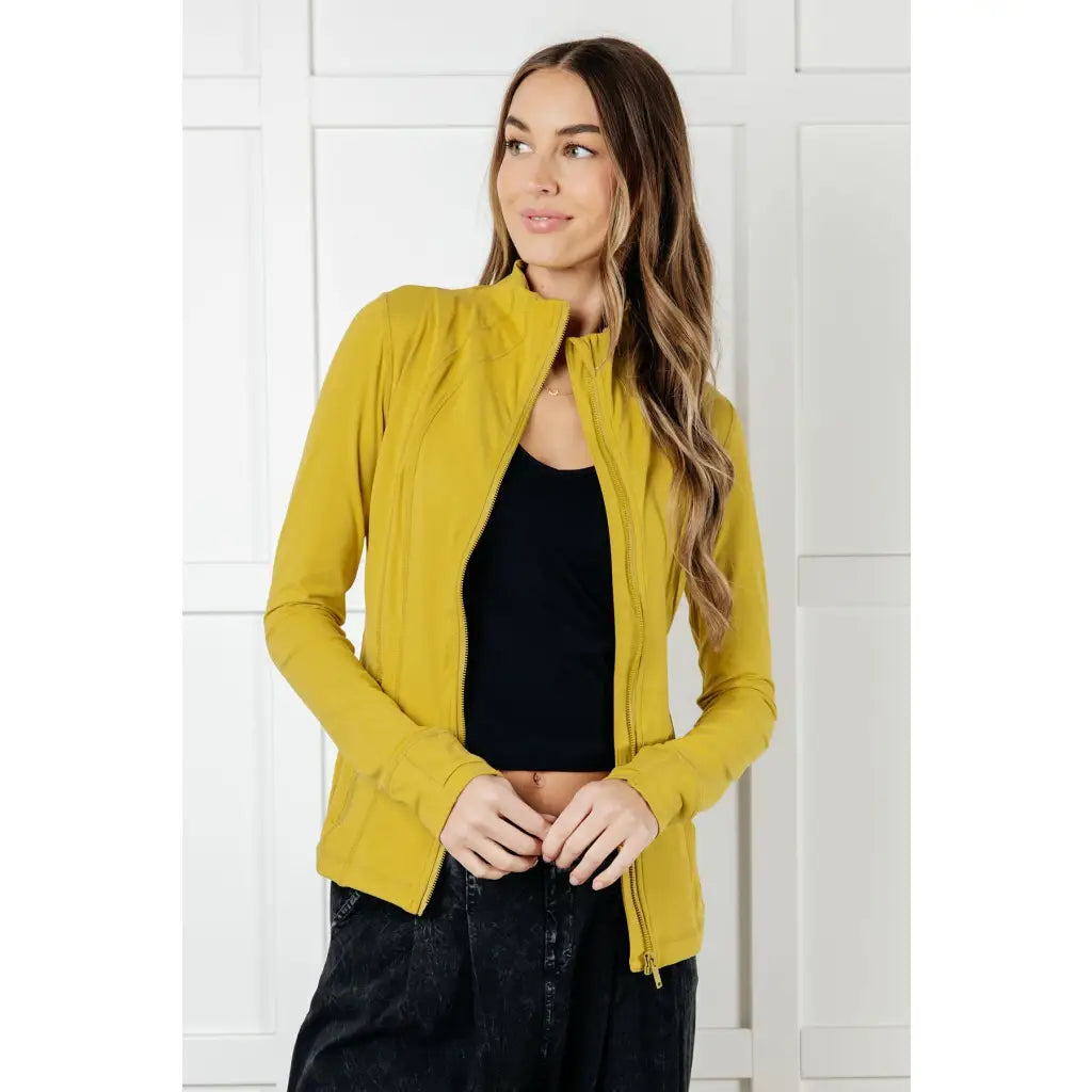 Our Pear-fectly Yellow Activewear Jacket is form-fitting and features a brushed microfiber material with mock neckline