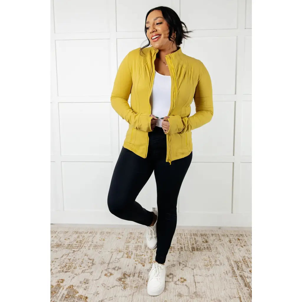 Our Pear-fectly Yellow Activewear Jacket is form-fitting and features a brushed microfiber material with mock neckline