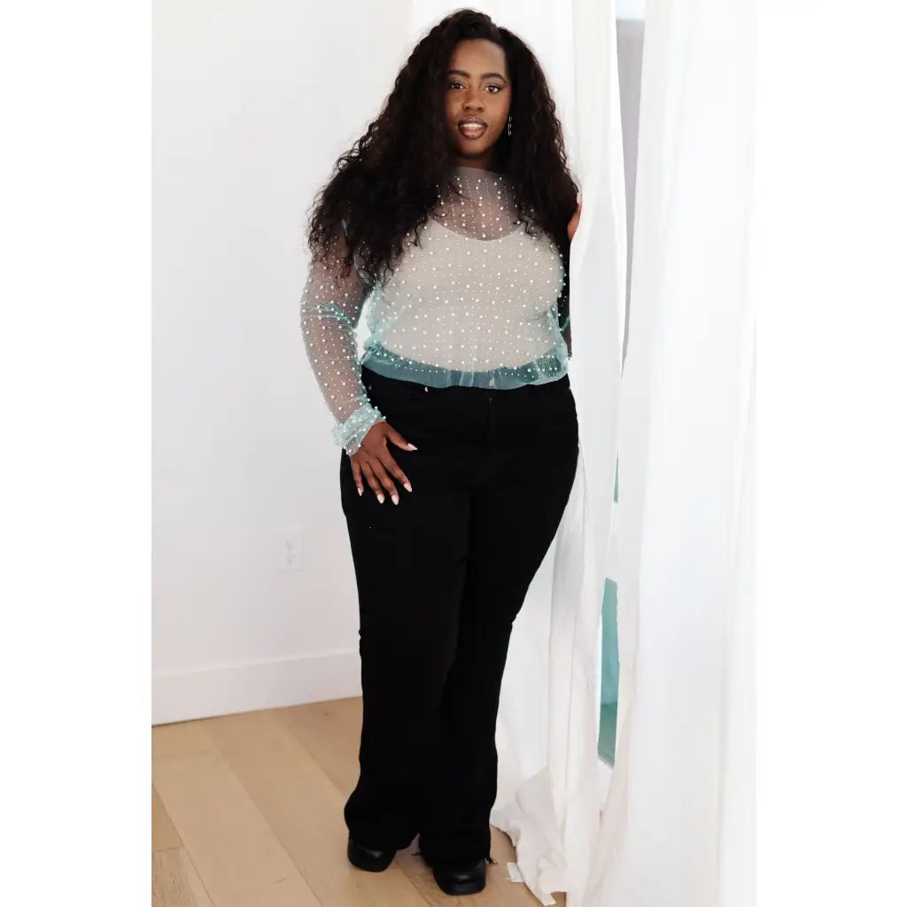 Our Pearl Diver Mesh Layering Top in Light Cyan is a stretchy long sleeve top embellished with faux pearls