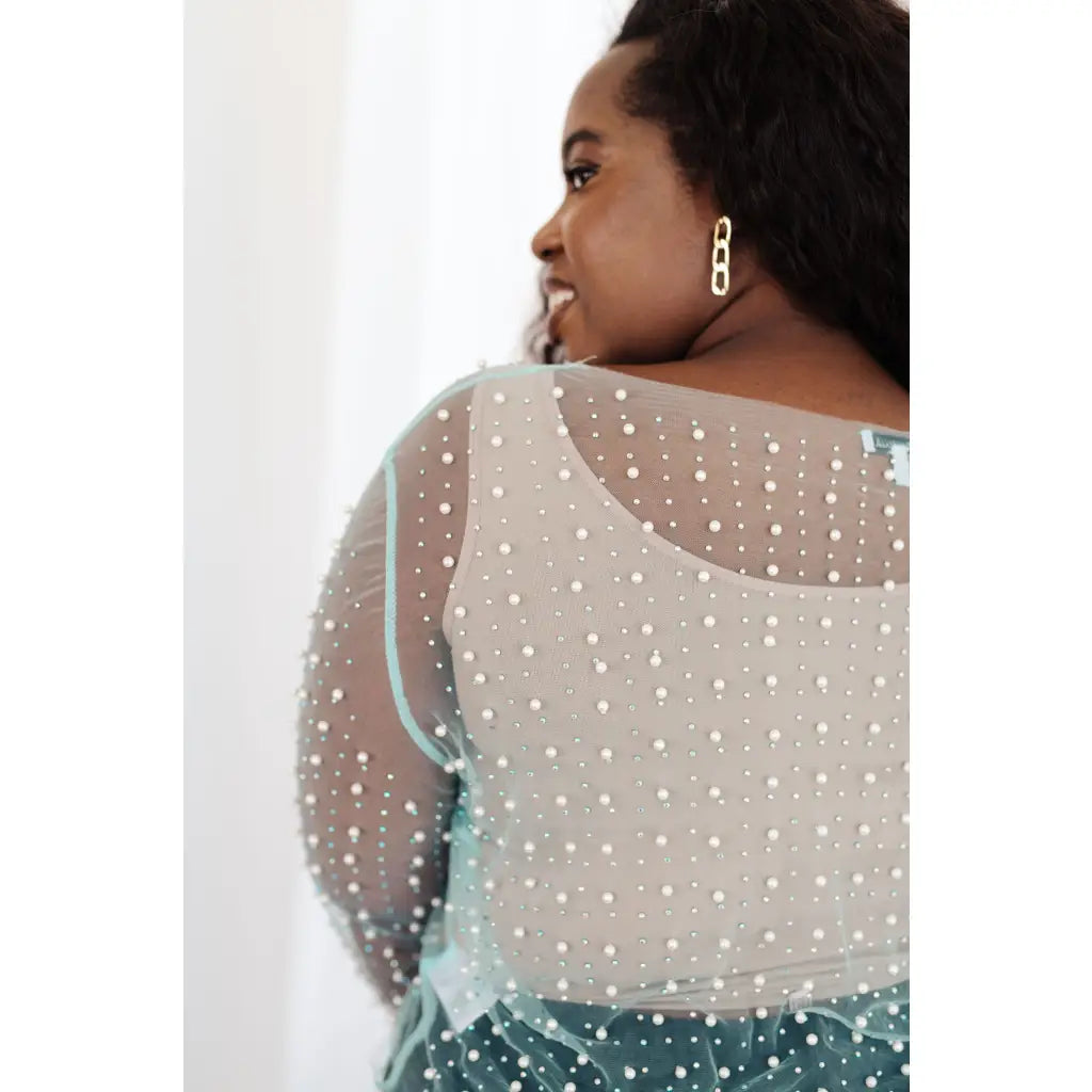 Our Pearl Diver Mesh Layering Top in Light Cyan is a stretchy long sleeve top embellished with faux pearls