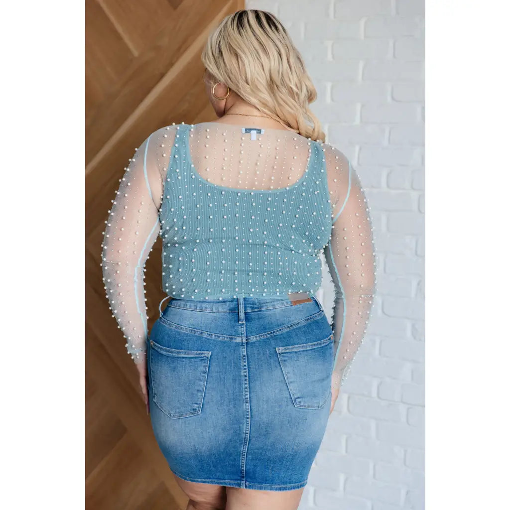 Our Pearl Diver Mesh Layering Top in Light Cyan is a stretchy long sleeve top embellished with faux pearls