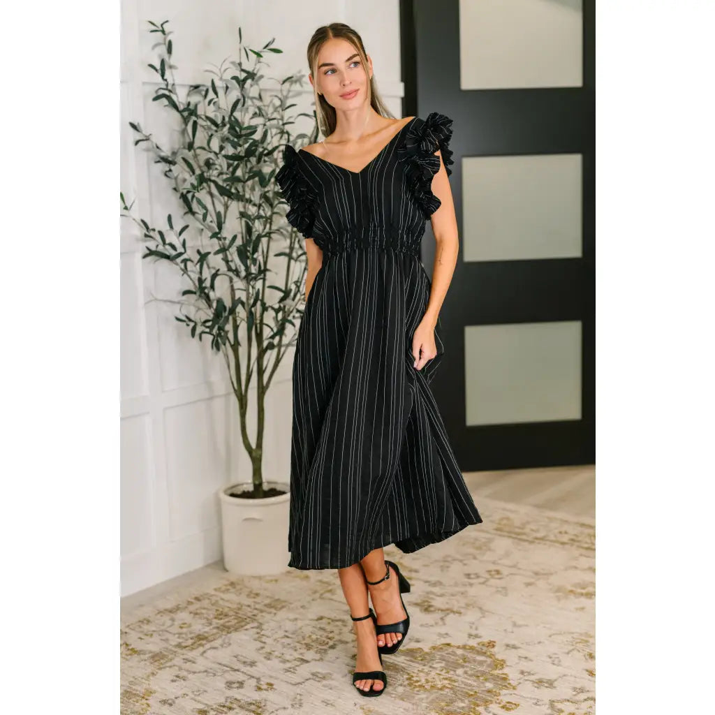 Ruffle My Pinstripes Midi Dress in black with white pinstripes. A chic plus size midi dress ruffle sleeves elastic