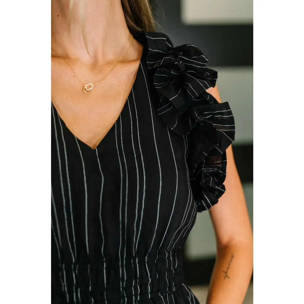 Ruffle My Pinstripes Midi Dress in black with white pinstripes. A chic plus size midi dress ruffle sleeves elastic
