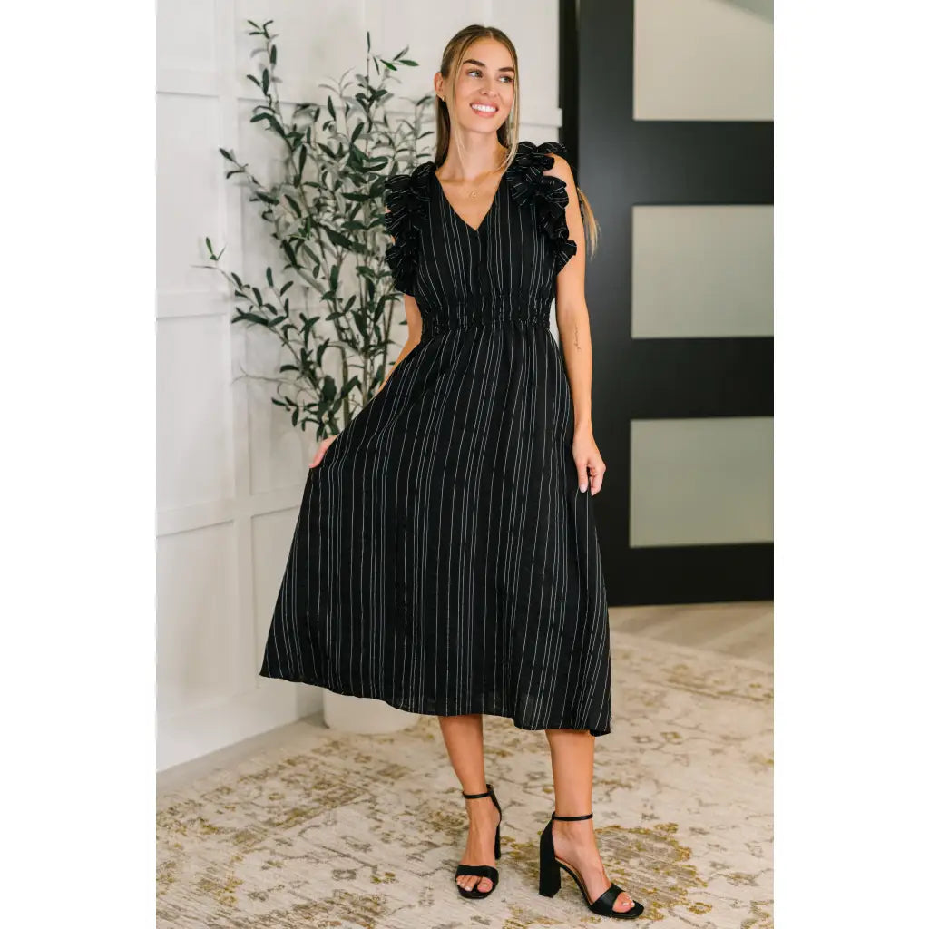 Ruffle My Pinstripes Midi Dress in black with white pinstripes. A chic plus size midi dress ruffle sleeves elastic