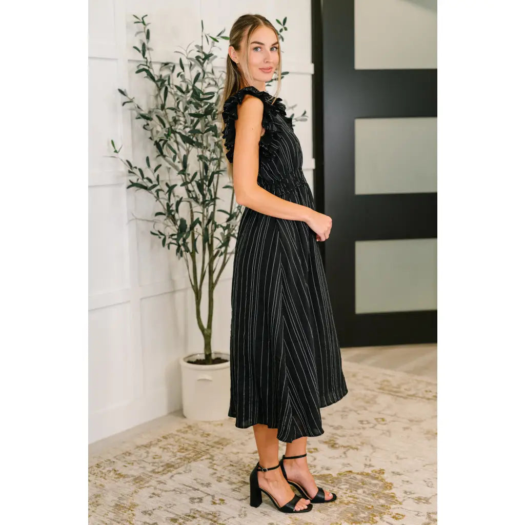 Ruffle My Pinstripes Midi Dress in black with white pinstripes. A chic plus size midi dress ruffle sleeves elastic