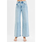 Chic pintuck detailed wide leg jeans with high waist stretch comfort and modern style. Elevated everyday stretchy denim