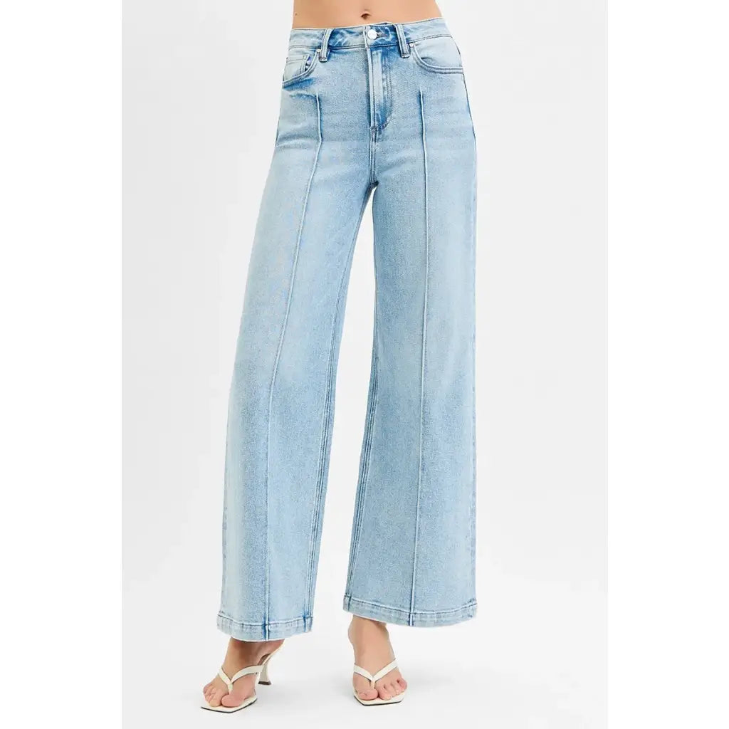 Chic pintuck detailed wide leg jeans with high waist stretch comfort and modern style. Elevated everyday stretchy denim