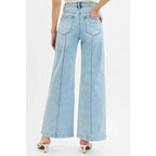 Chic pintuck detailed wide leg jeans with high waist stretch comfort and modern style. Elevated everyday stretchy denim