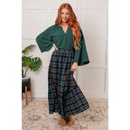 Fall in love with this plaid maxi skirt featuring a tiered hem and elastic back waist. A perfect plus size holiday look