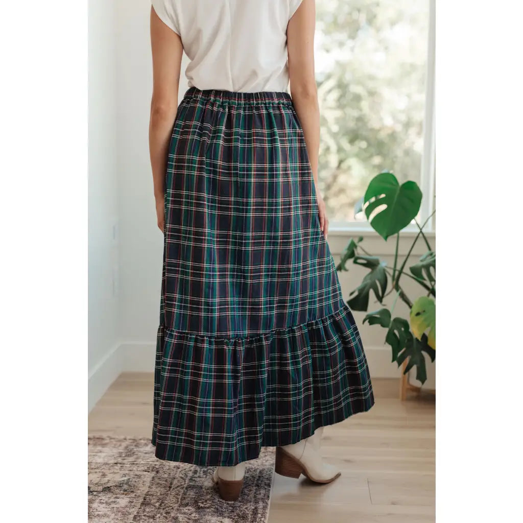 Fall in love with this plaid maxi skirt featuring a tiered hem and elastic back waist. A perfect plus size holiday look