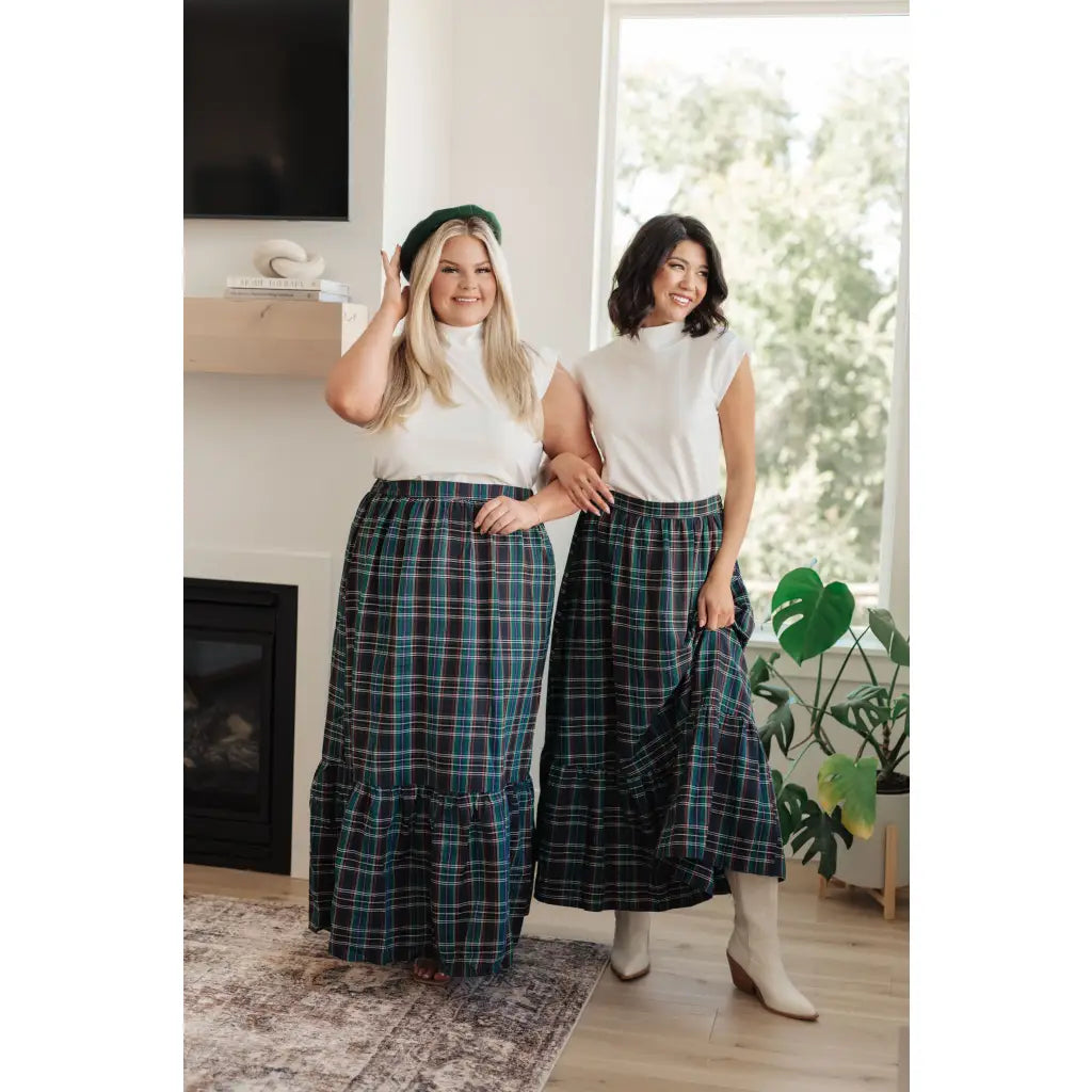 Fall in love with this plaid maxi skirt featuring a tiered hem and elastic back waist. A perfect plus size holiday look