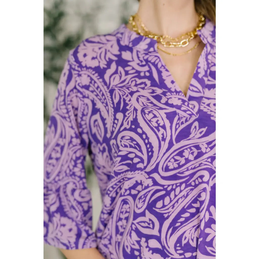 Shop this purple paisley mini dress in wrinkle resistant Bulgari fabric. Available standard and plus sizes