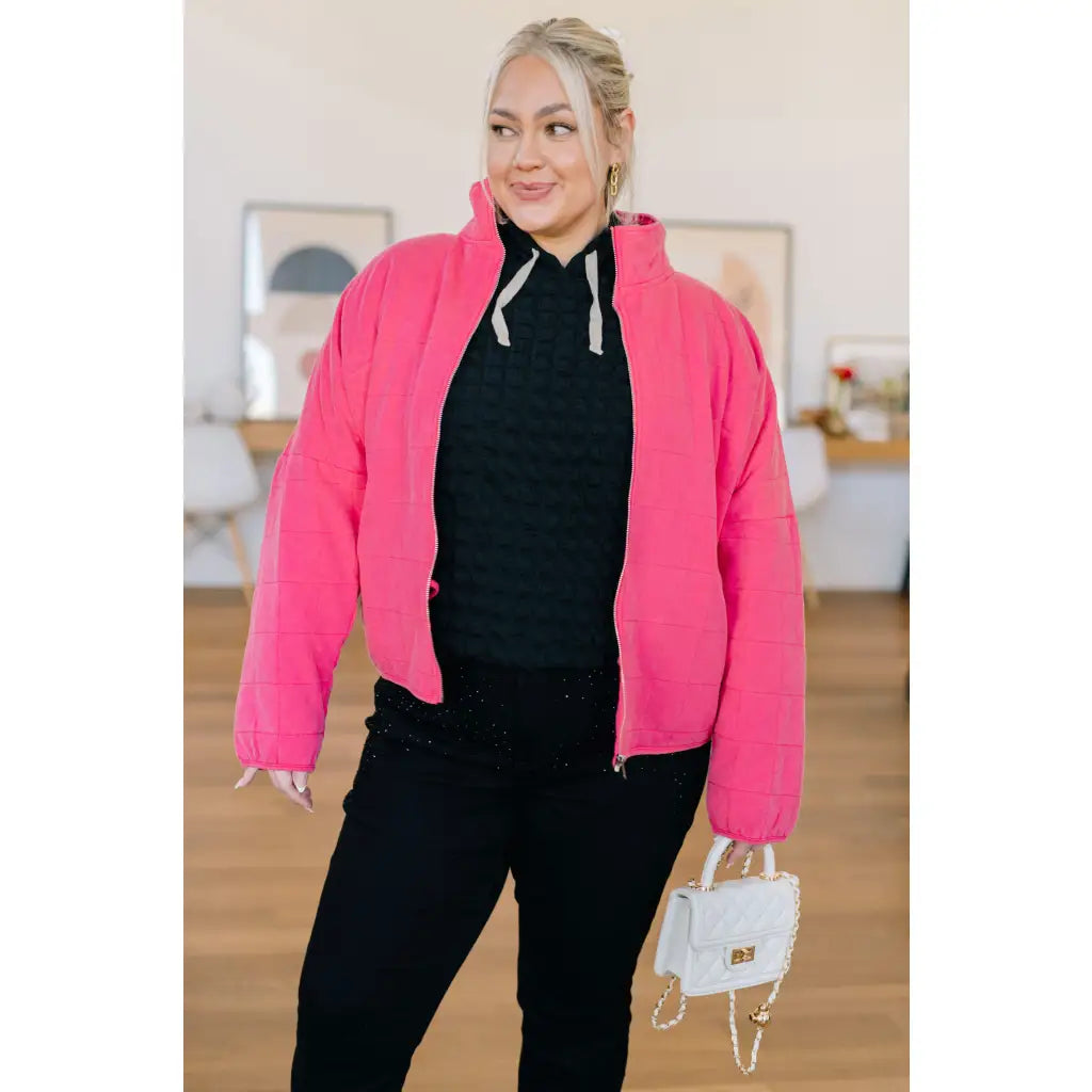 Pink quilted jacket with zip front and mock neckline. Oversized fit plus size friendly. Mineral wash style perfect