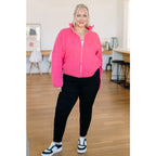 Pink quilted jacket with zip front and mock neckline. Oversized fit plus size friendly. Mineral wash style perfect