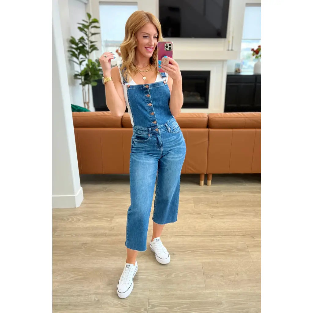Step out in style with Priscilla High Rise Crop Wide Leg Denim Overalls from Judy Blue! These chic retro-style overalls