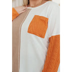 Colorblock knit top with pumpkin orange latte brown and cream panels. Boutique fall essential! SM-3XL a relaxed fit