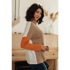 Colorblock knit top with pumpkin orange latte brown and cream panels. Boutique fall essential! SM-3XL a relaxed fit