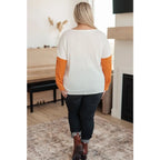 Colorblock knit top with pumpkin orange latte brown and cream panels. Boutique fall essential! SM-3XL a relaxed fit
