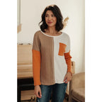 Colorblock knit top with pumpkin orange latte brown and cream panels. Boutique fall essential! SM-3XL a relaxed fit