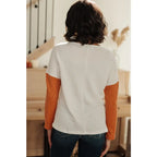 Colorblock knit top with pumpkin orange latte brown and cream panels. Boutique fall essential! SM-3XL a relaxed fit