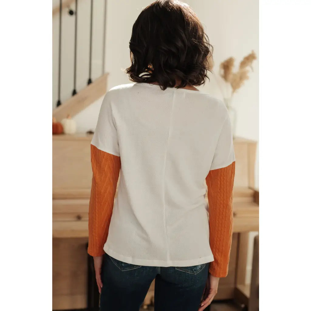 Colorblock knit top with pumpkin orange latte brown and cream panels. Boutique fall essential! SM-3XL a relaxed fit