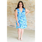 Wrinkle-resistant faux wrap dress in blue floral with built-in shorts. Soft Bulgari fabric and flattering fit. Plus