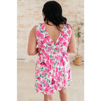 Wrinkle-resistant pink floral faux wrap dress with built-in shorts. Soft Bulgari fabric and flattering fit. Plus size