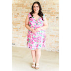 Wrinkle-resistant pink floral faux wrap dress with built-in shorts. Soft Bulgari fabric and flattering fit. Plus size