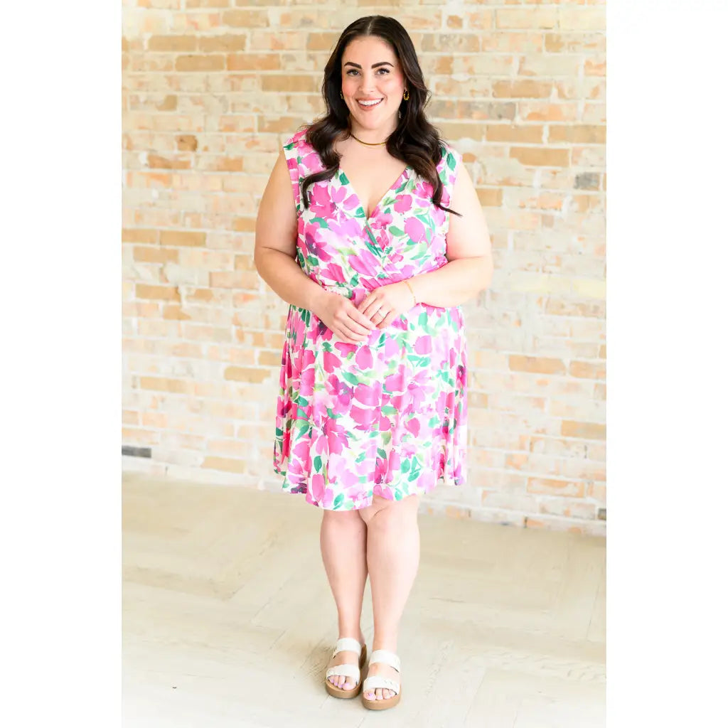 Wrinkle-resistant pink floral faux wrap dress with built-in shorts. Soft Bulgari fabric and flattering fit. Plus size