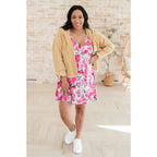 Wrinkle-resistant pink floral faux wrap dress with built-in shorts. Soft Bulgari fabric and flattering fit. Plus size