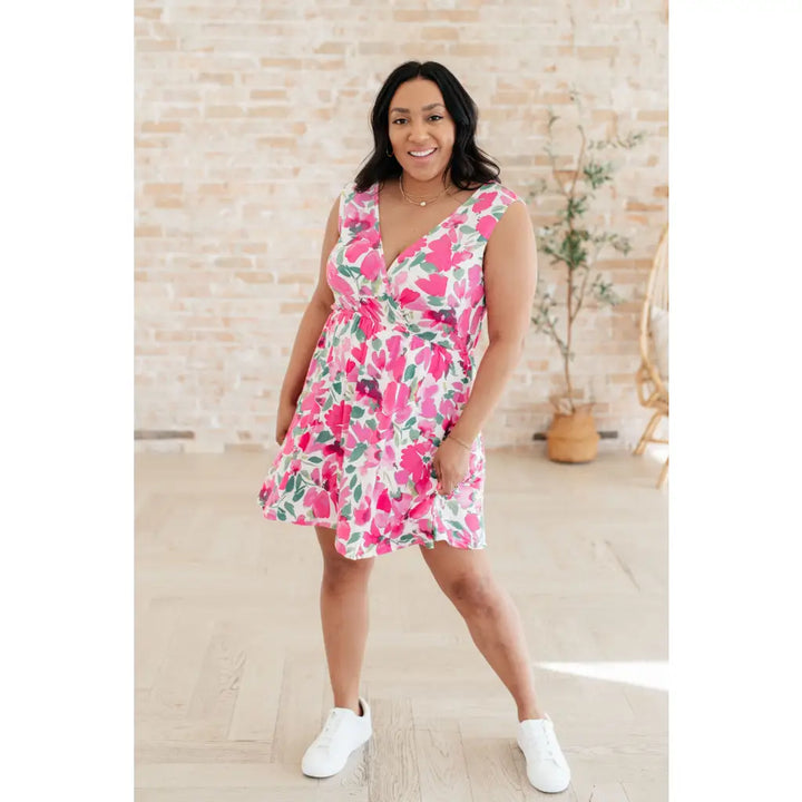 Wrinkle-resistant pink floral faux wrap dress with built-in shorts. Soft Bulgari fabric and flattering fit. Plus size