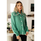 Our relaxed and cozy Ready for Surprises Cardigan features a soft green sweater knit exaggerated shawl collar contrast