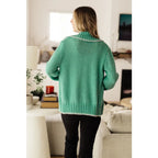 Our relaxed and cozy Ready for Surprises Cardigan features a soft green sweater knit exaggerated shawl collar contrast