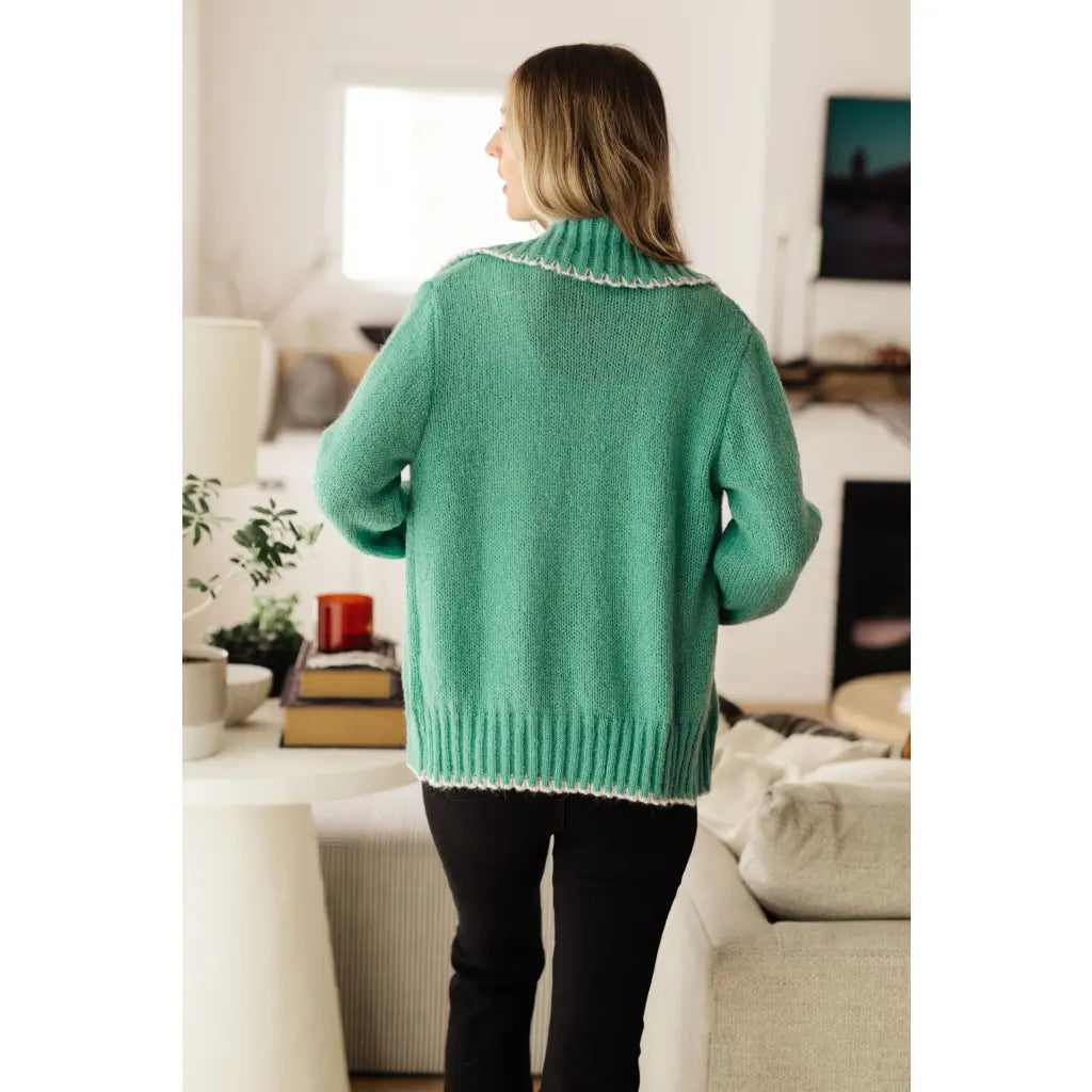 Our relaxed and cozy Ready for Surprises Cardigan features a soft green sweater knit exaggerated shawl collar contrast