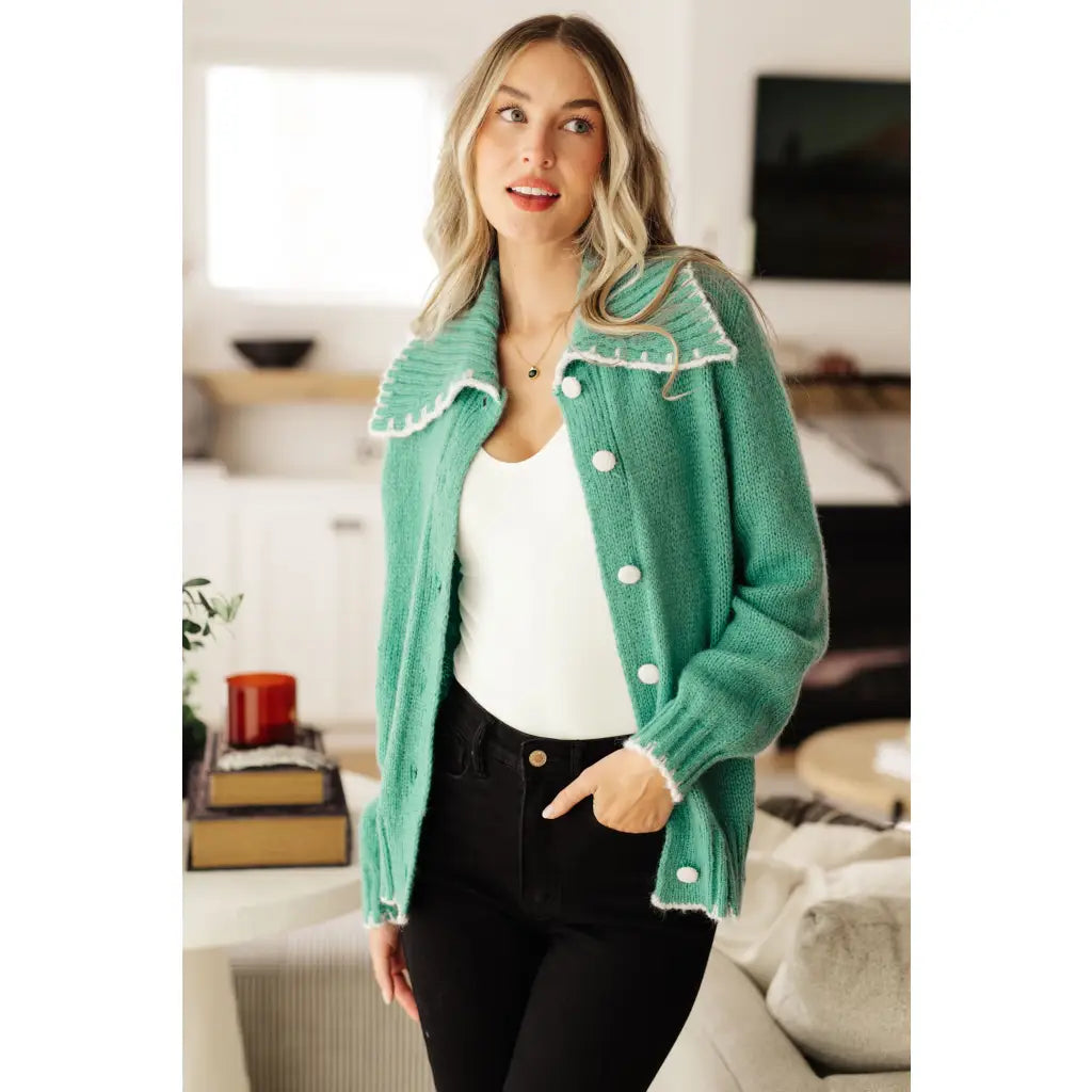Our relaxed and cozy Ready for Surprises Cardigan features a soft green sweater knit exaggerated shawl collar contrast