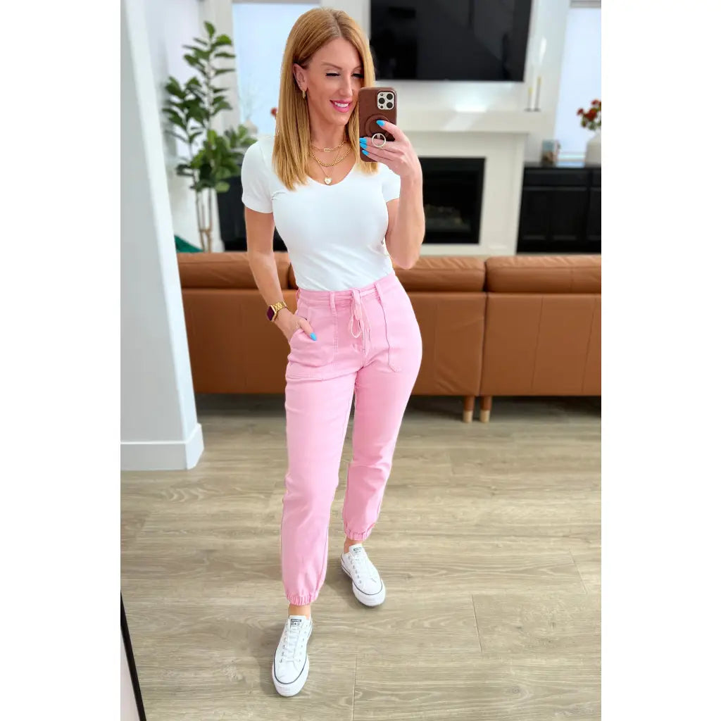Slip into chic comfort with the Pretty in Pink Denim Joggers by Judy Blue. Boutique glam meets playful vibes — curvy