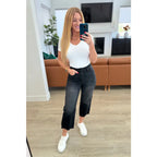 Get ready to rock stylishly with our Ryan Wide Leg Crop Judy Blue Jeans in Black! The stretchy denim features