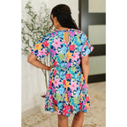 Floral navy mini dress with bubble sleeves pockets and godet hem. Perfect fit for regular curvy plus sizes boutique