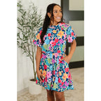 Floral navy mini dress with bubble sleeves pockets and godet hem. Perfect fit for regular curvy plus sizes boutique