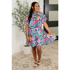 Floral navy mini dress with bubble sleeves pockets and godet hem. Perfect fit for regular curvy plus sizes boutique