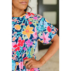 Floral navy mini dress with bubble sleeves pockets and godet hem. Perfect fit for regular curvy plus sizes boutique