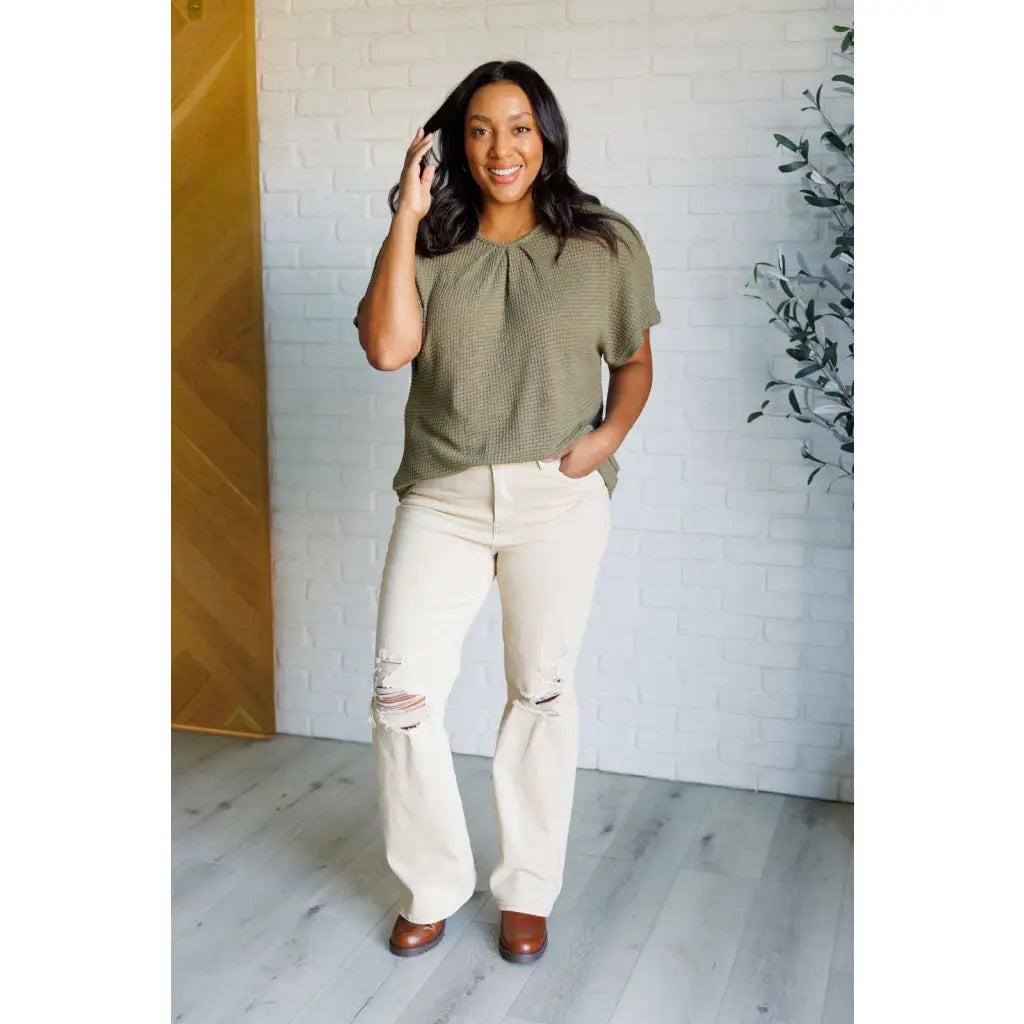 Our Secret Details Lace Back Top is made from a light olive green waffle knit fabric with high stretch for ultimate