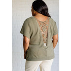 Our Secret Details Lace Back Top is made from a light olive green waffle knit fabric with high stretch for ultimate